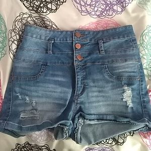 Medium wash ripped high waisted shorts